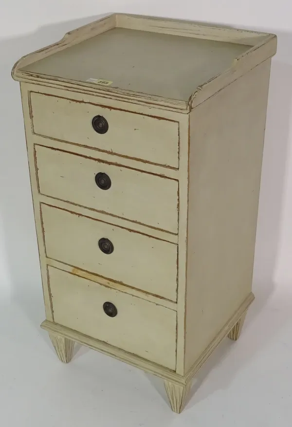 A cream painted four drawer bedside table, 41cm wide x 80cm high.