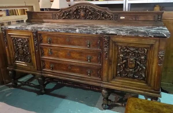 A late 19th century marble topped Spanish walnut sideboard with three central drawers flanked by carved cupboards, 226cm wide.