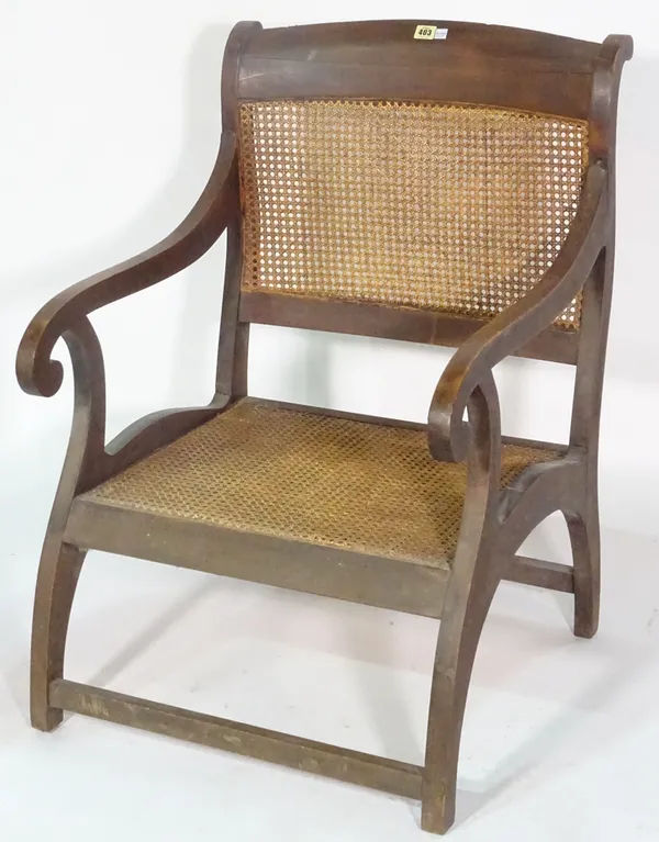 An unusual 19th century stained beech open armchair with cane back and seat, 62cm wide x 91cm high.
