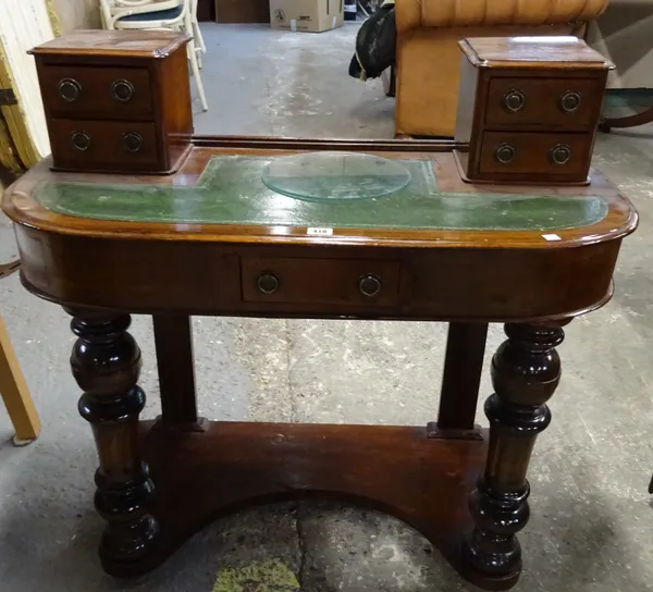 A Victorian mahogany Duchess dressing table, on turned supports, 90cm wide x 84cm high.