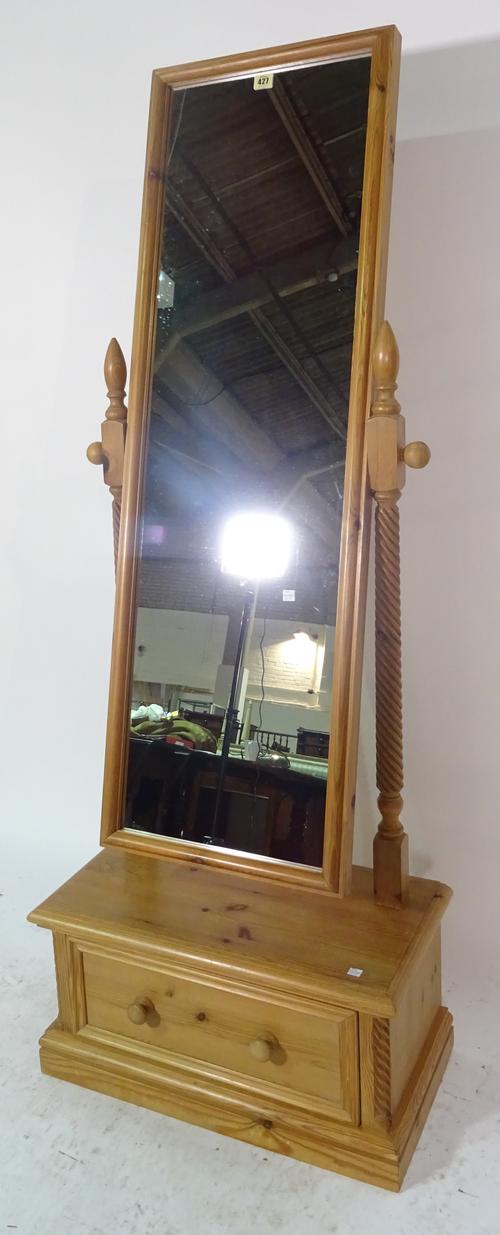 A 20th century pine cheval mirror with single drawer plinth base, 50cm wide x 160cm high.