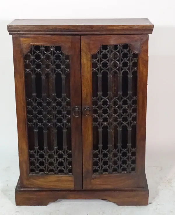A 20th century hardwood side cabinet with iron grille doors, 63cm wide x 88cm high.