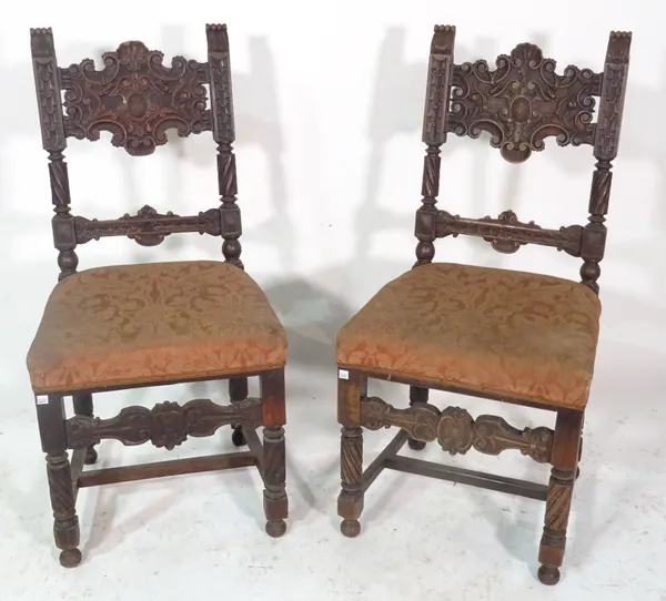 A pair of 19th century carved oak hall chairs of Charles II style, 47cm wide x 97cm high (2).