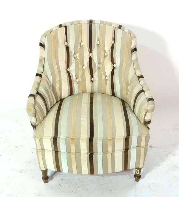 A 20th century low tub chair with striped upholstery.