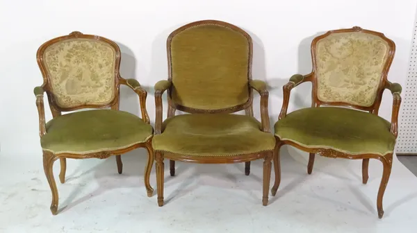 A pair of Louis XVI style beech open arm fauteuil chairs and another similar, (3).