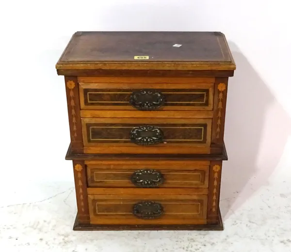 An Edwardian rosewood miniature chest of four long drawers, 38cm wide x 43cm high.