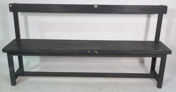 An early 20th century black painted hall bench on block supports, 153cm wide x 92cm high.