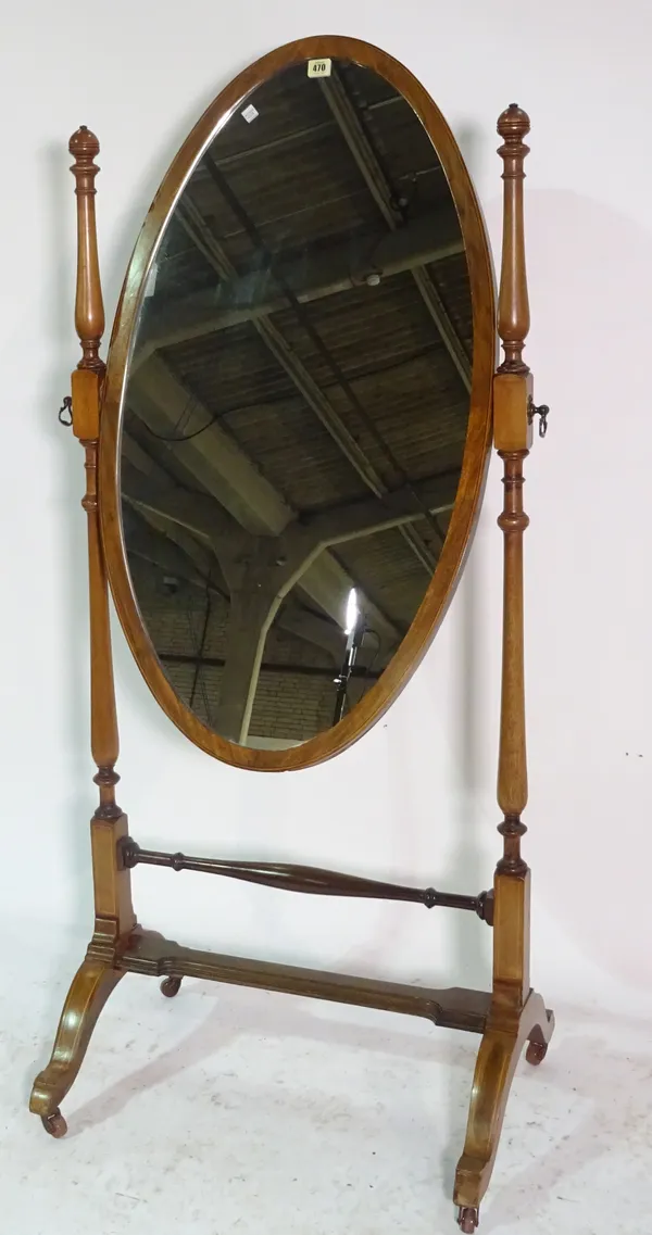 A 20th century mahogany framed cheval mirror with oval plate, 68cm wide x 154cm high.