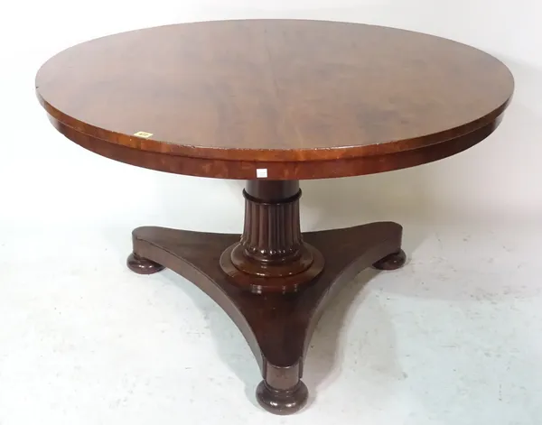 A early 19th century mahogany low circular table, on trefoil base and bun feet, 115cm wide x 75cm high.