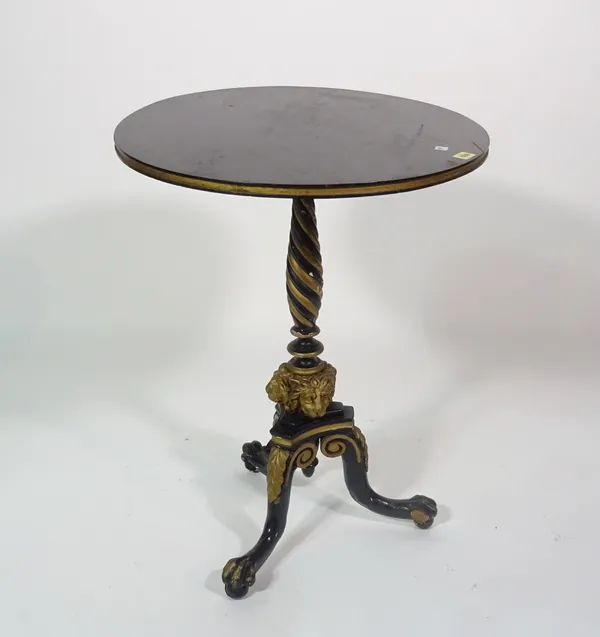 A Victorian parcel gilt ebonised tripod table base, with lion mask mounts and ball and claw feet, 75cm high, the later top 57cm diameter.