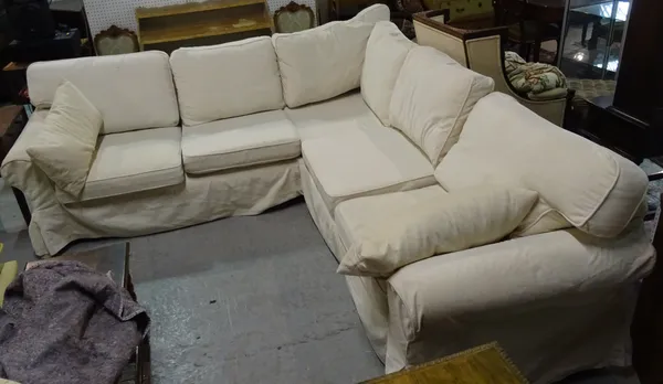 A modern cream corner sofa, 241cm wide x 241cm deep.