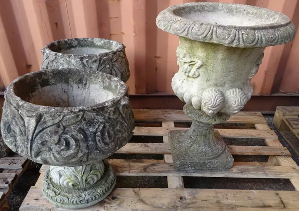 Garden statuary, comprising; a pair of acanthus reconstituted stone garden urns on plinth bases, 40cm wide x 62cm high and another similar, 50cm wide