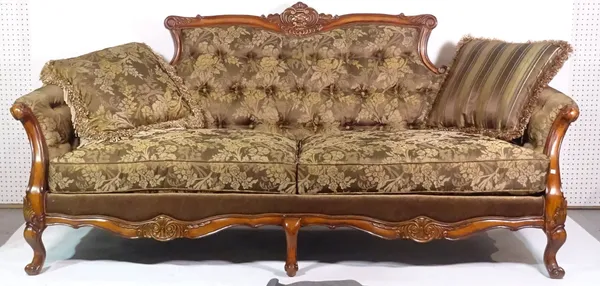 A 20th century hardwood framed sofa on six scroll supports, 235cm wide x 108cm high.