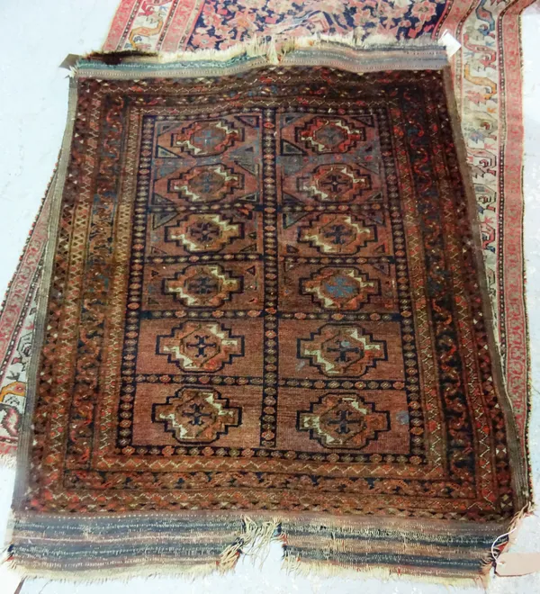 A Fereghan rug, indigo field with allover design, 190cm x 120cm and an Afghan rug, madder field with twelve guls, 134cm x 109cm, (2).