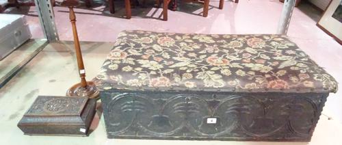 An 18th century carved oak bible box with later tapestry lid, 79cm wide, a carved mahogany jewellery box, 25cm wide and a wig stand (3).