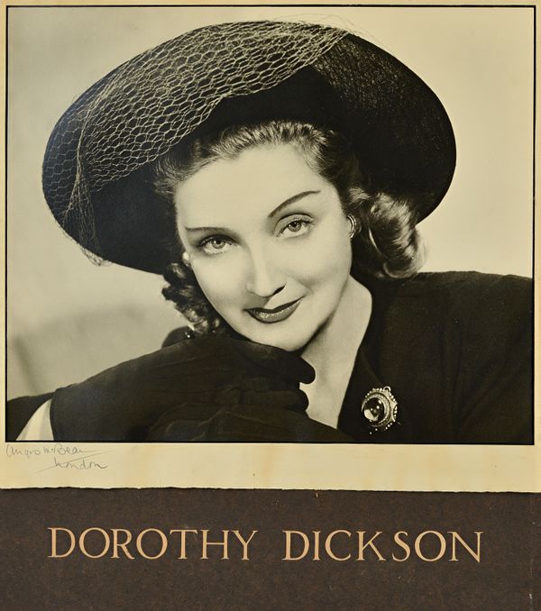 ANGUS MCBEAN  (1904 - 1990)  Dorothy Dickson:  portrait mounted and signed by the photographer in pencil on the cream mount, captioned beneath, 45cm.
