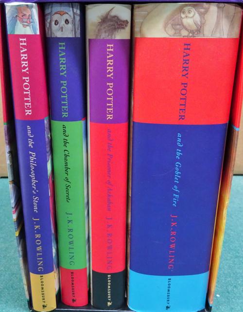 HARRY POTTER:  a set of four hardback Harry Potter books, 'The Philosopher's Stone' signed by members of the film cast. Bloomsbury 'It's Magic' box se