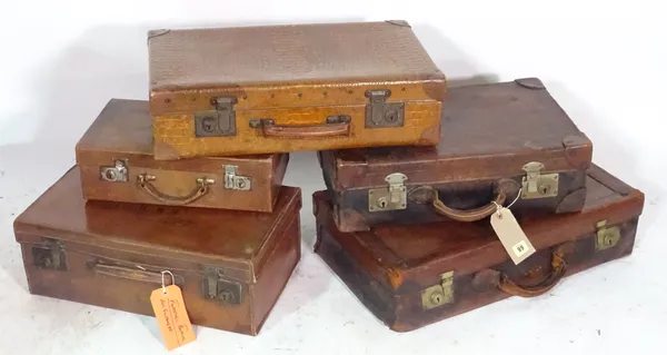 A group of five various leather suitcases, (5).