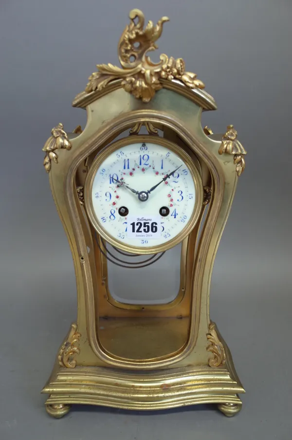 A French four glass mantel clock of waisted form, late 19th century, with foliate painted enamel dial and two train movement, the gilt metal pendulum