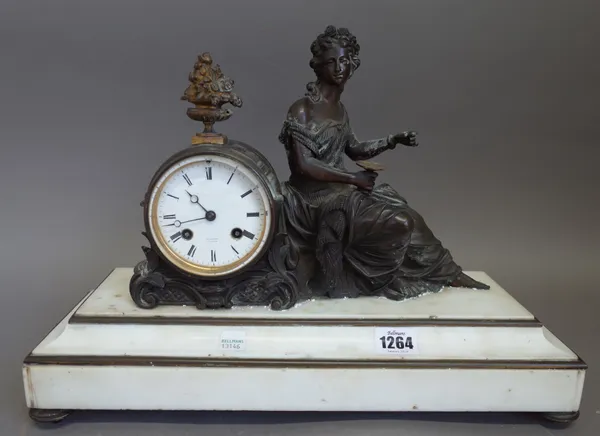 A French figural bronze and white marble mantel clock, 19th century, with classical maiden surmount seated against a drum case, the white enamel dial