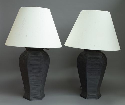 A pair of 'Forestier' modern wire work table lamps of hexagonal baluster form, with flecked cream shades, 71cm high overall and a pair of bronzed meta