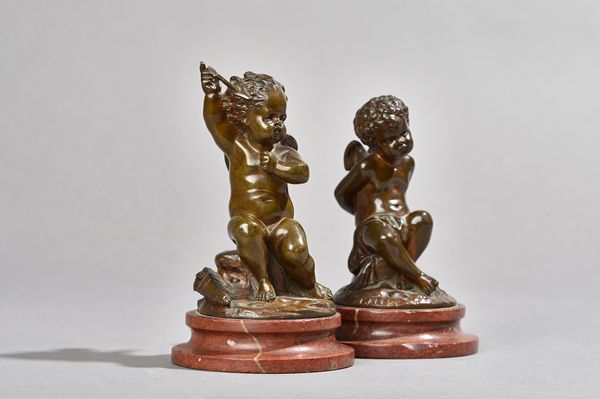 Louis Kley, (French 1833 - 1911), a pair of bronze Cupid figures, representative of 'Love Bound' and 'Love Striking', each on a turned rouge marble pl