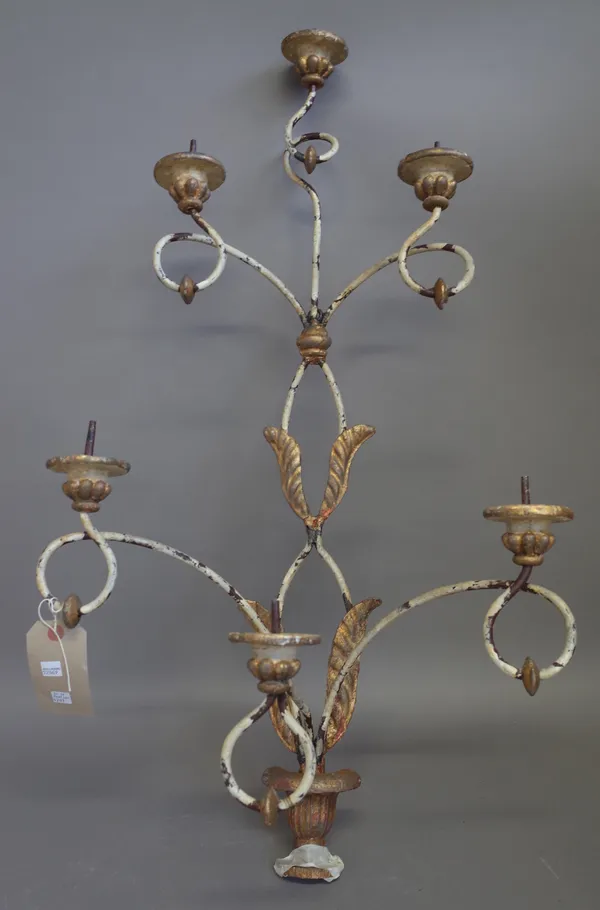 A pair of modern gilt and cream painted wrought iron and composite six branch wall appliques, 89cm high. (a.f) (2)