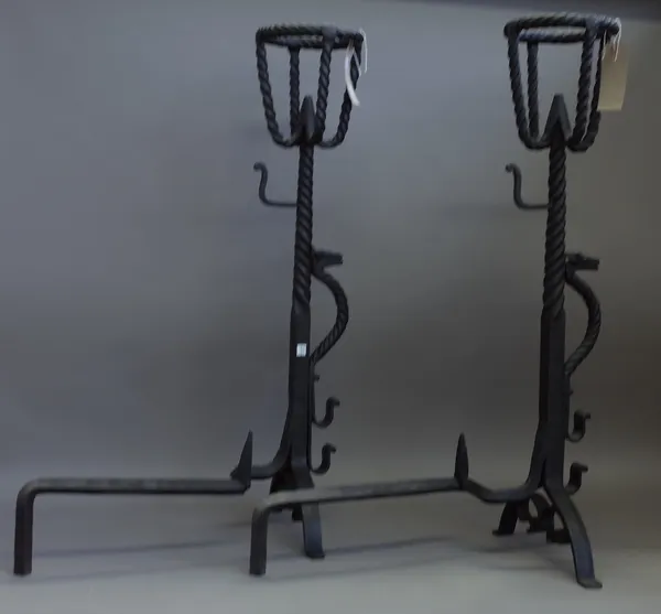 A pair of modern wrought iron andirons, each of spiral twist form with basket finials and applied 'dragon' to shaft, 89cm high. (2)