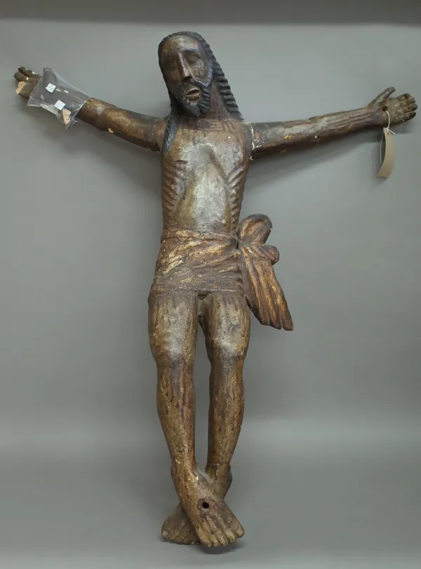 A polychrome decorated carved wooden figure of Jesus in crucifix position, 96cm high, (a.f.).   492