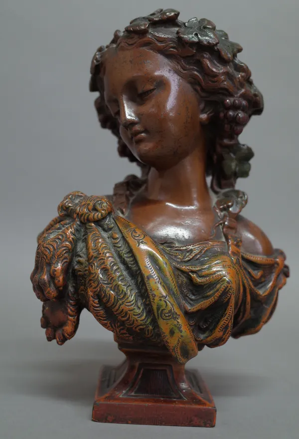 After Marin, a bronzed metal bust of a classical female, raised on a square foot, unsigned 18.5cm high.
