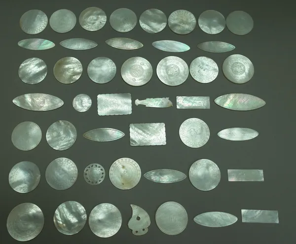 One hundred and twenty three Chinese mother-of-pearl gaming counters, late 19th century, each of shaped foliate engraved form, (123). 1541, 1542