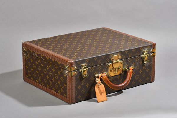 A Louis Vuitton attache case with monogrammed canvas, brass hardware and fitted interior. 'Printed number 1030479' (two keys), 45cm x 35cm x 17cm. Ill