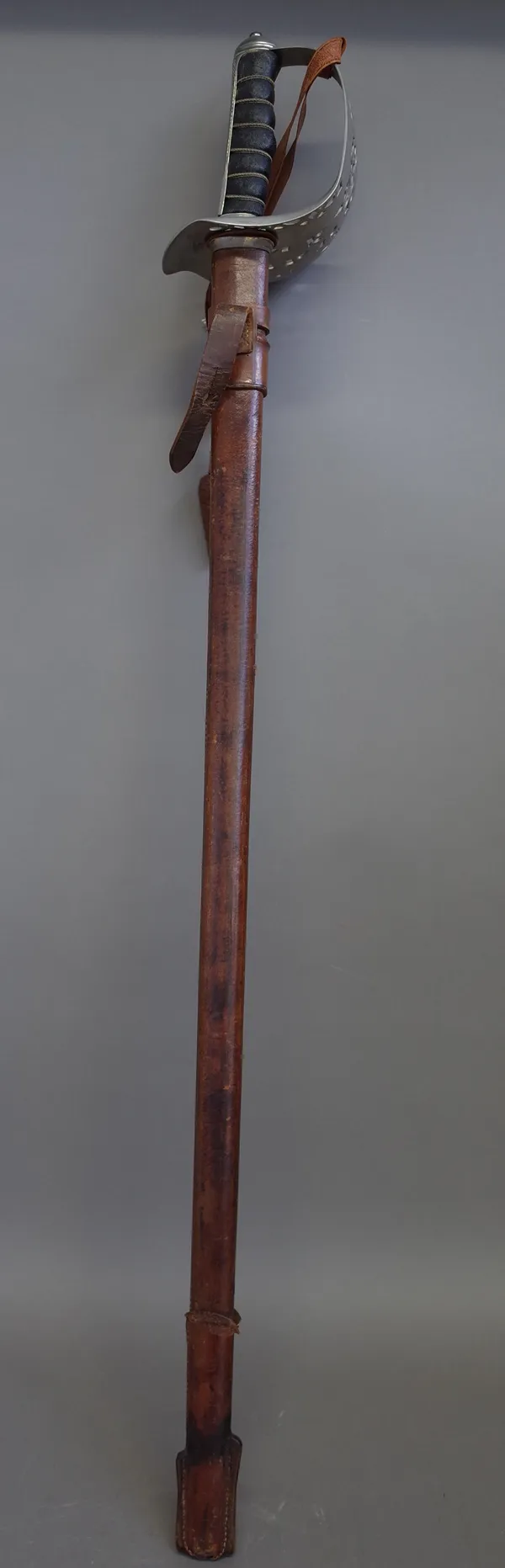 A George V officer's sword with straight polished engraved blade, 83cm, pierced hilt and wire bound leather grip in a leather scabbard and a Japanese
