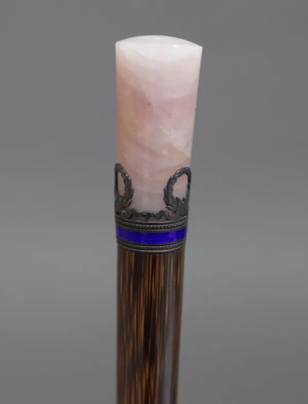 A silver and enamel mounted bamboo parasol handle with a rose quartz cylindrical  handle, hallmarked G A S (probably for Georg Adam Scheid), 30cm.  14