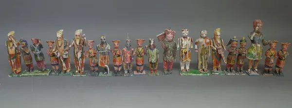 A group of Indian early 20th century painted wool and gesso figures, each with moveable arms, mainly members of a band playing instruments, (a.f.), th