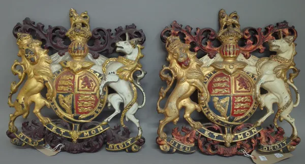 Two polychrome painted cast iron English Coat of Arms, late 19th century, Lion & Unicorn flanking a central shield with Latin verse beneath, 38cm high