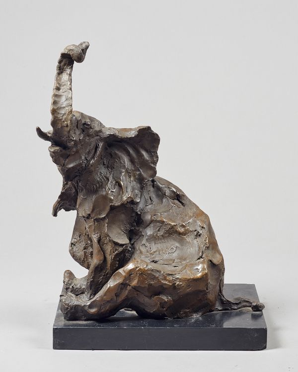 Untitled, seated bronze elephant, unsigned, on a polished black marble plinth, bronze 48.5cm high.