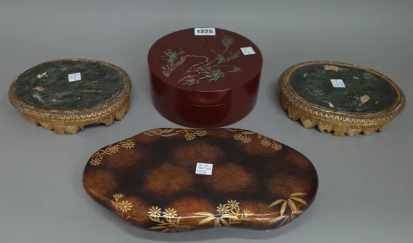 A Japanese lacquered circular box and cover, 16cm diam, a Japanese lacquered games compendium, lacking cover, a pair of Chinese giltwood oval stands o