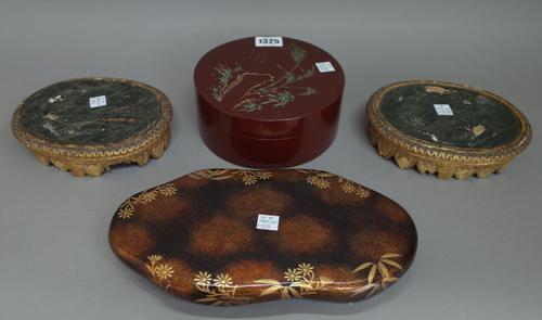 A Japanese lacquered circular box and cover, 16cm diam, a Japanese lacquered games compendium, lacking cover, a pair of Chinese giltwood oval stands o