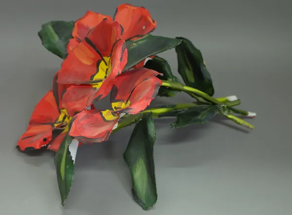 In the manner of Julian Opie, painted metal flowers, unsigned, 43cm high. 1982