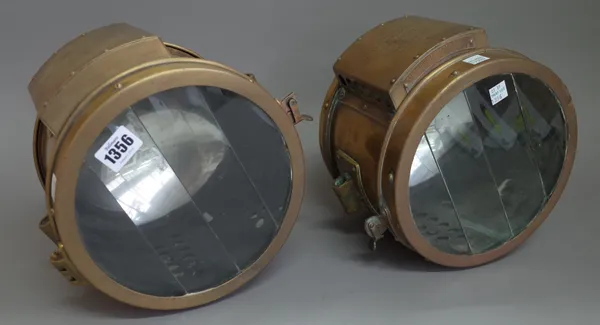 A pair of eight inch Rushmore brass cased searchlights by Rushmore Dynamo works. (2)