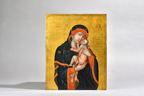 A Russian icon painted on board, 19th century, depicting Madonna and Child against a gilt ground with an oil portrait of a bearded man to the reverse,