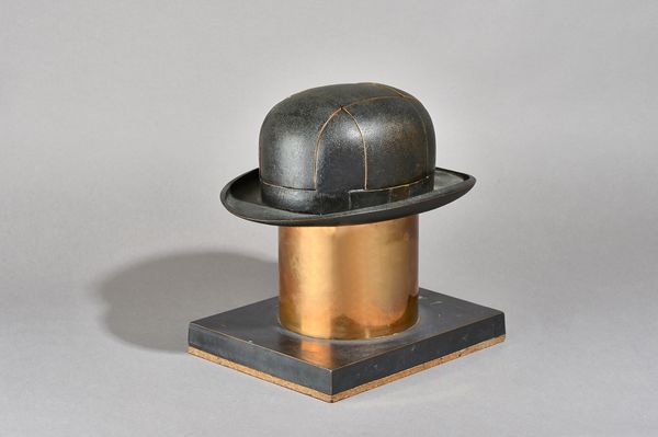 Stern, Ltd Ed 0/6, a patinated bronze bowler hat sculpture, signed, of hinged sectional form enclosing erotic picture prints over a bronze plinth, 28.