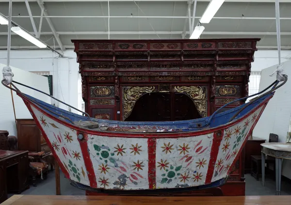 A vintage fairground swing boat rider, early 20th century, with foliate polychrome decoration against a wooden wrought iron body. (a.f.) 185cm wide.