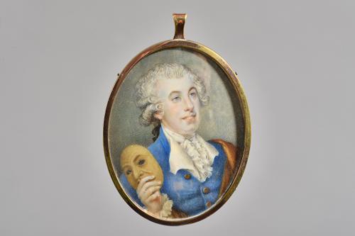 Late 18th century English school, portrait on miniature of an actor- possibly David Garrick, depicted in blue coat, white stock and holding  a mask, l