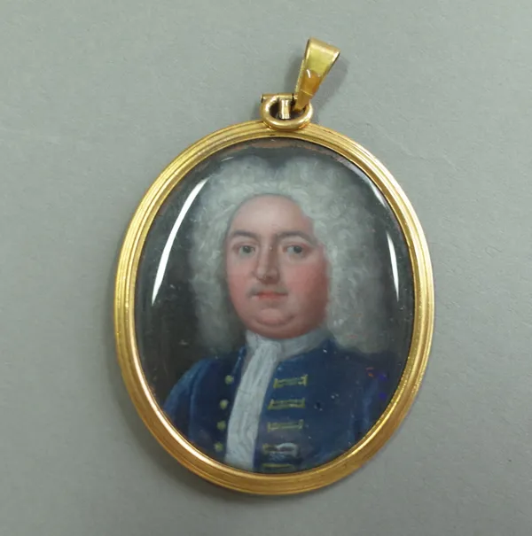 An 18th century school portrait miniature on copper of a gentleman, blue coat with gold buttons and detailing, gold frame detailed .585 to loop, image
