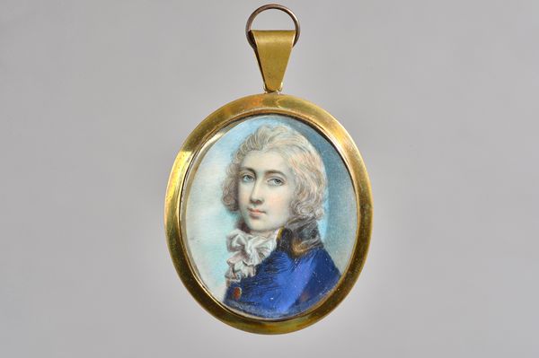 Attributed to George Engleheart, (1780-1829); a portrait miniature on ivory of a young man, blue coat with black collar, later frame, old inscription