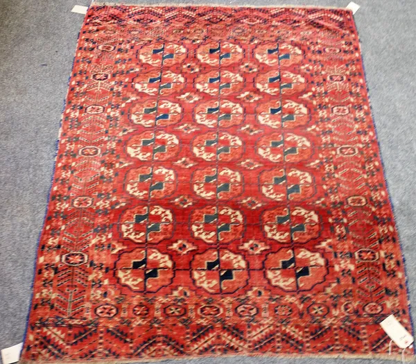 A Tekke Turkman rug, the madder field with three columns of seven guls, leaf skirt ends, 173cm x 133cm.