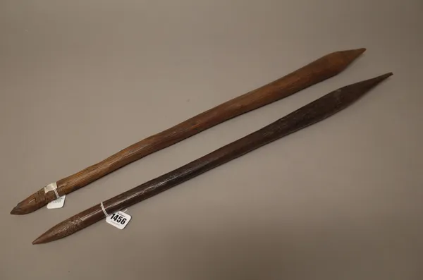 Two Australian Aboriginal hardwood clubs, each with bulbous tapering end and crudely carved grip, the longest 70.5cm, (2).