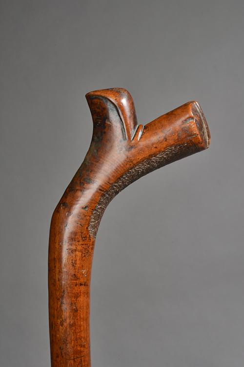 A Fijian hardwood Kiakavo (gunstock) war club, possibly for a child, carved decoration to stock and tip of handle, 71cm. Illustrated
